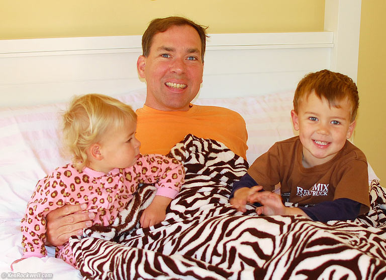 Katie, Ryan and Daddy play in the new bed