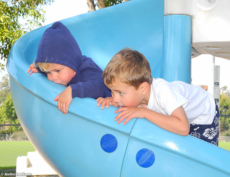 Katie and Ryan kissing the slide.