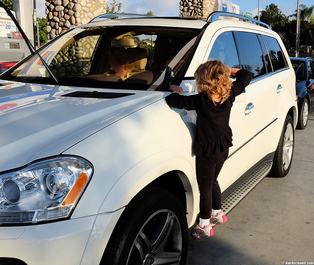 Katie washes Stomper's windshield.