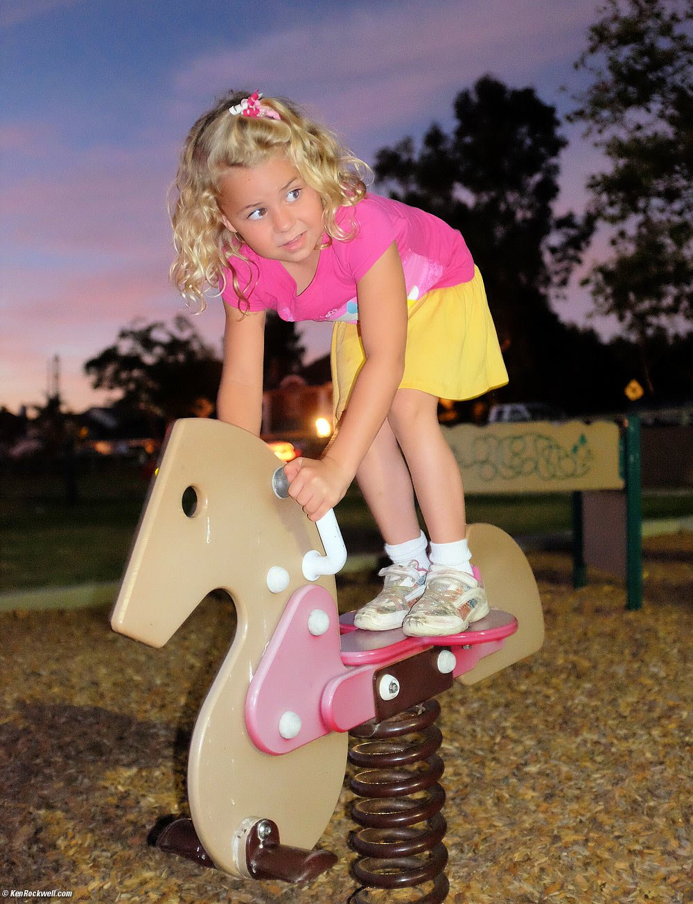 Katie at the park for a concert at dusk