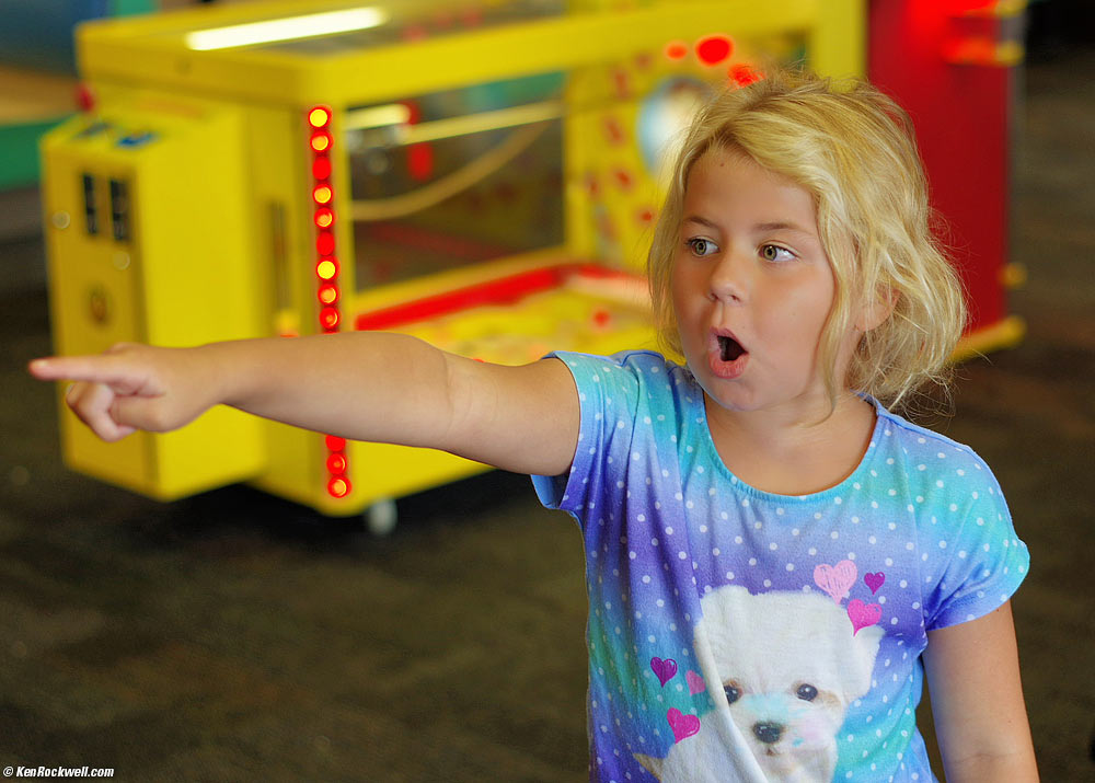 Katie plays the big spinner at Chuck E. Cheese's