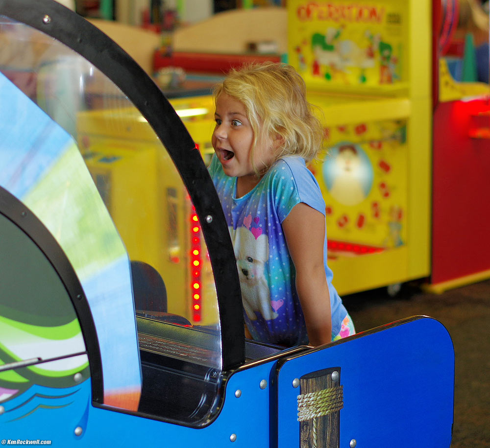 Katie plays the big spinner at Chuck E. Cheese's