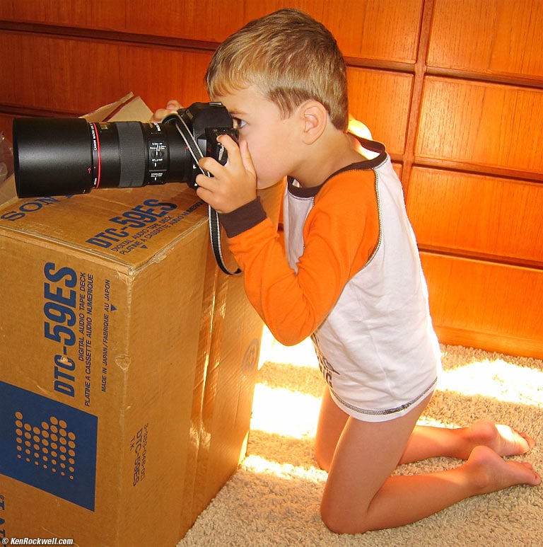 Ryan and Canon 100mm and EOS 620, standing on a DAT Machine