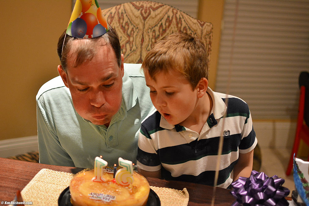 Ryan and Dada blowing out Dada'a birthday cake.