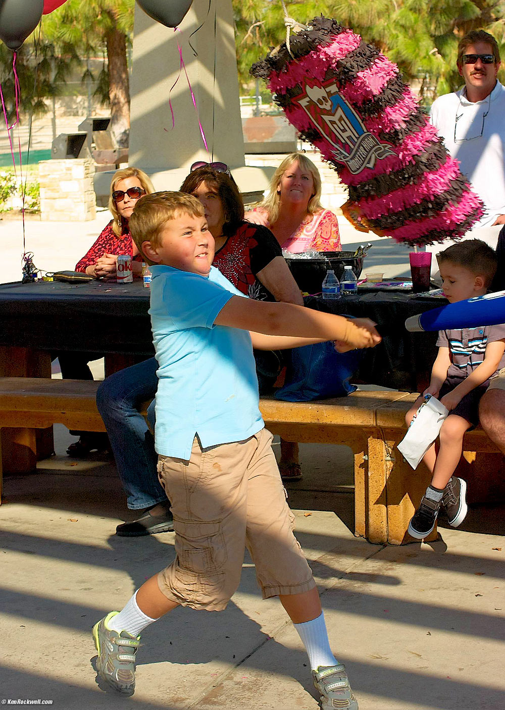 Ryan slams the Piñata at Skyler's party the Dinosaur Park.
