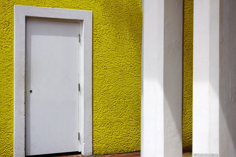 White door on yellow wall, Nassau, Bahamas