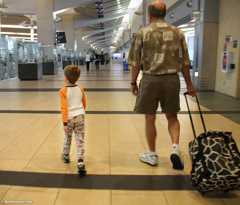 Ryan and Pops head towards baggage claim, 6:52 AM. 