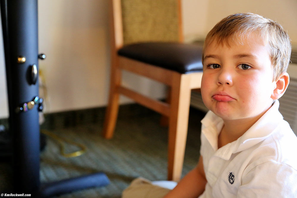 Ryan mimicks the sad face he made on the metal table support with his magnetic rocks, Furnace Creek Resort, Death Valley, California 8:34 AM.