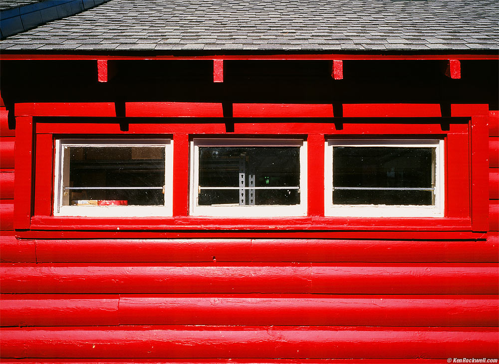 Red Log-Cabin Market with Three Windows