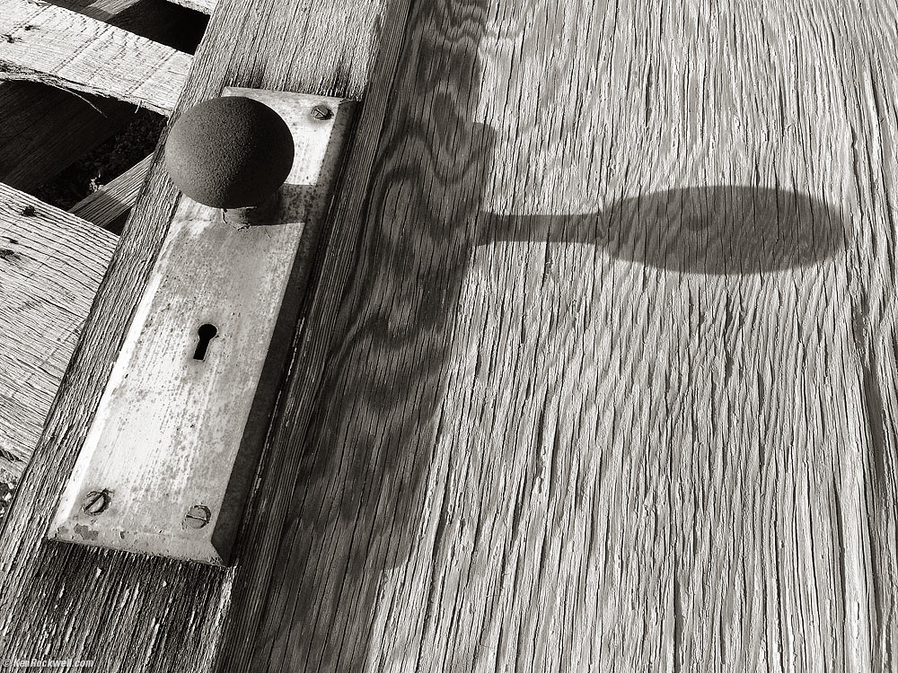 Doorknob casting shadow in B&W
