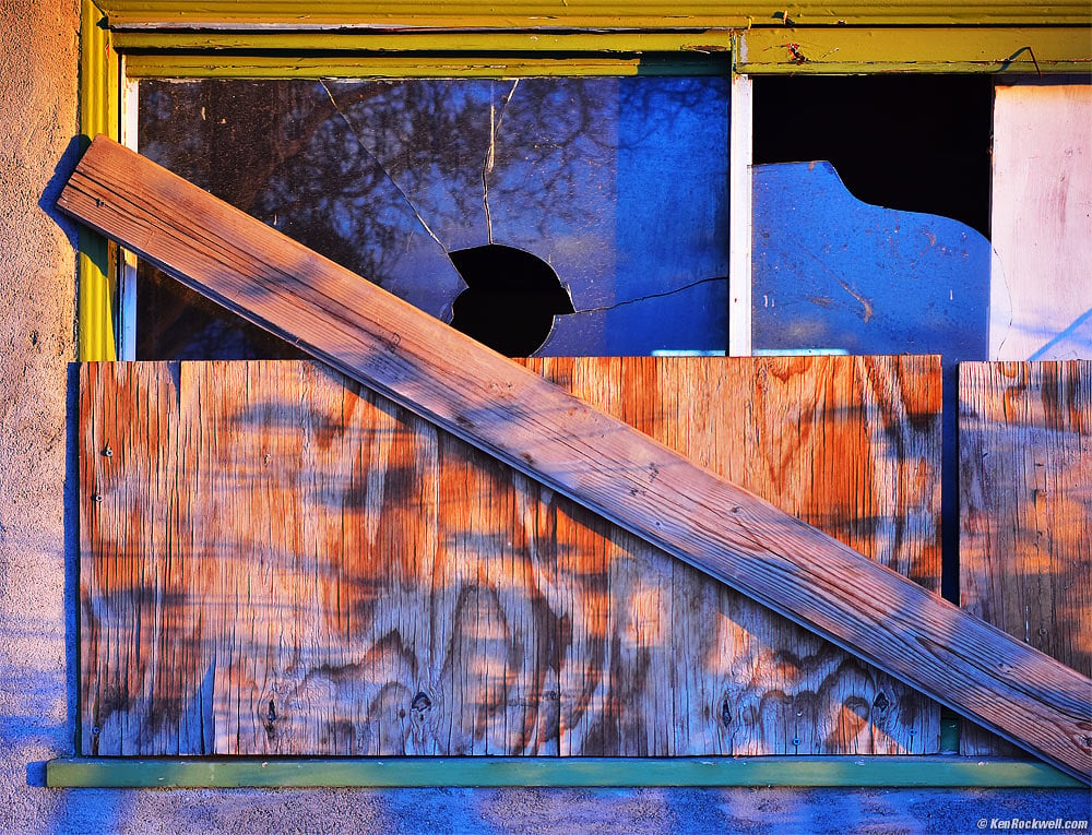 Last Light on Colorful Boarded-Up Broken Window, West Barstow