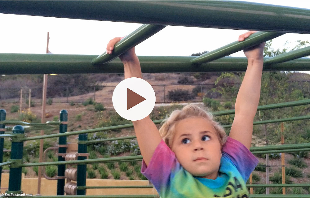 Katie does the monkey bars just like a real monkey!