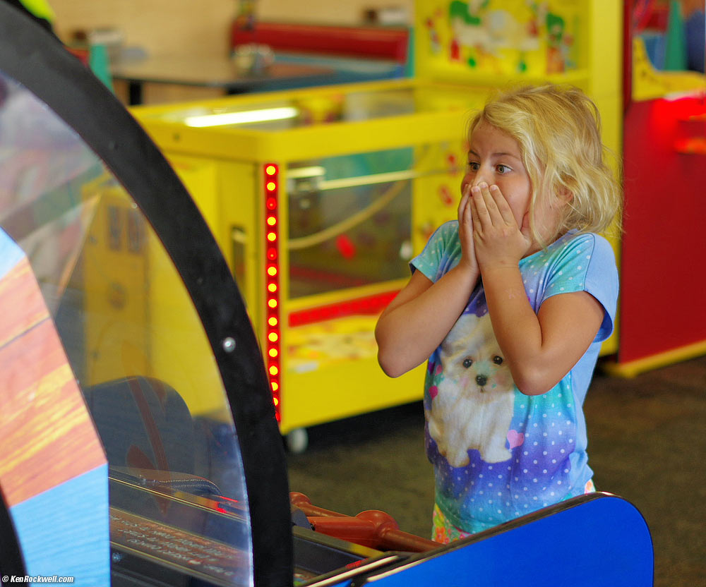 Katie plays the big spinner at Chuck E. Cheese's