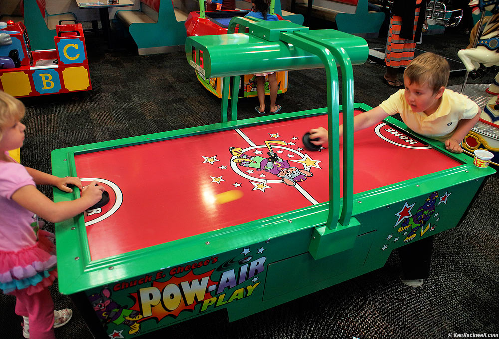 Ryan and Katie play air hockey.