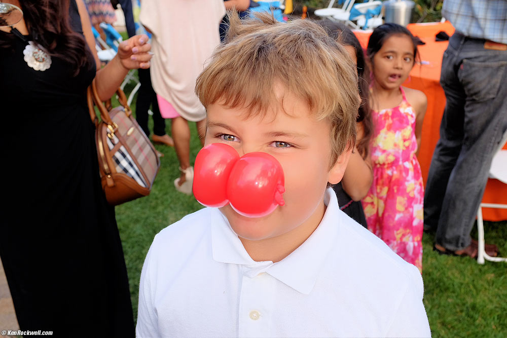 Ryan gets another funny nose from the balloon guy. 