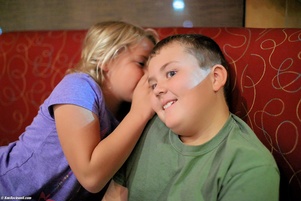 Katie whispers to Ryan at Empanada Tuesday