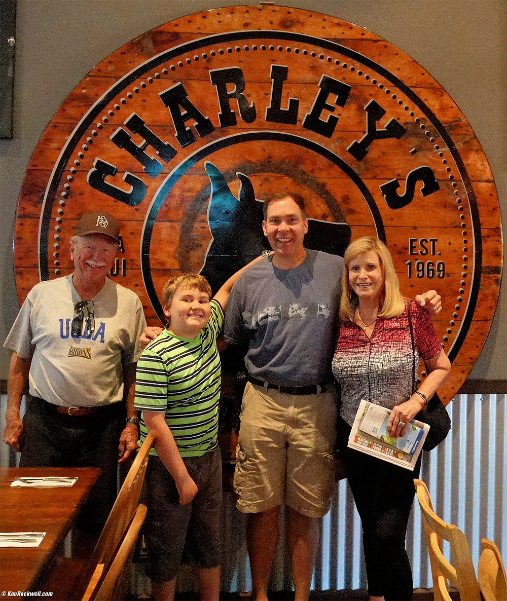 Ryan and Dad by the giant Willie Nelson guitar at Charley's Restaurant and Saloon, Paia, Maui