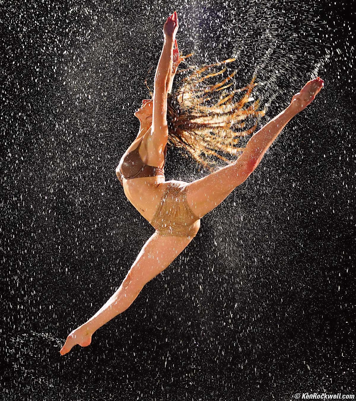 Girl dancing naked in the rain