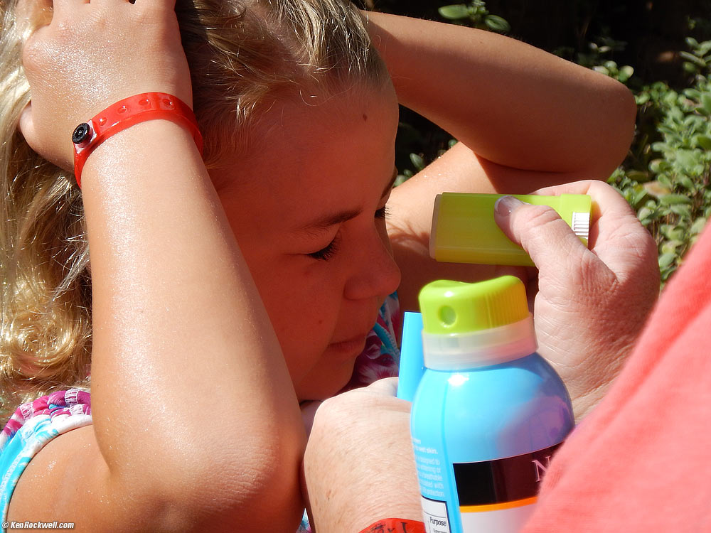 Katie gets her face painted with lotion